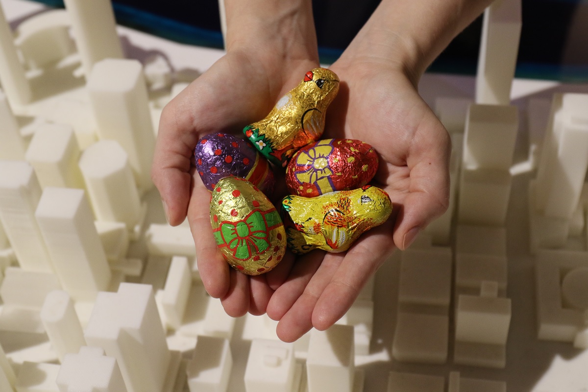 Chocolate eggs being held in a hand.